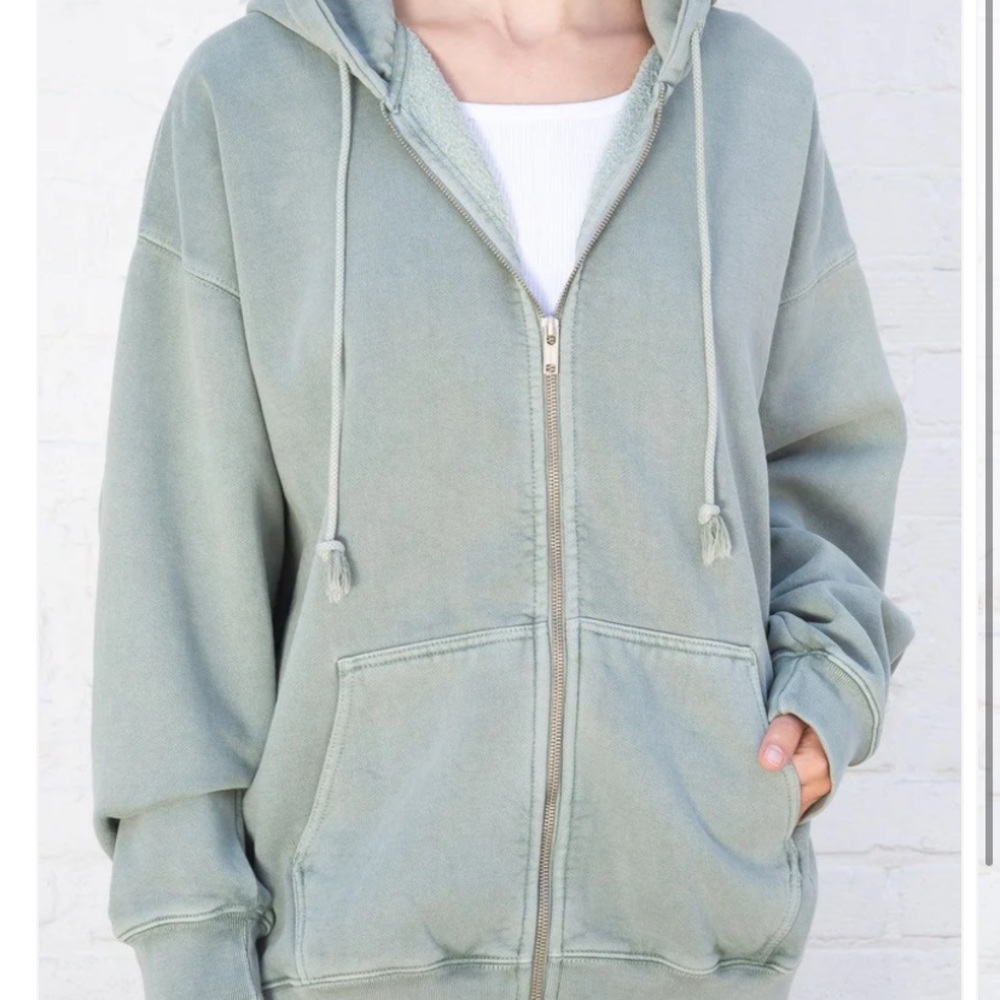 A brandy Melville zip up hoodie in sage green